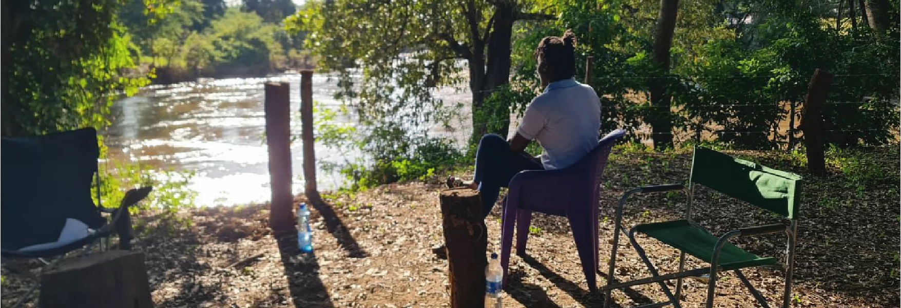 A peaceful riverside sitting area at Thiba River Camp